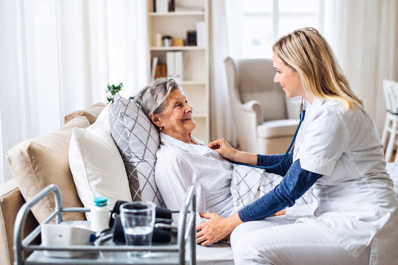 Nurse providing care at a patient's home